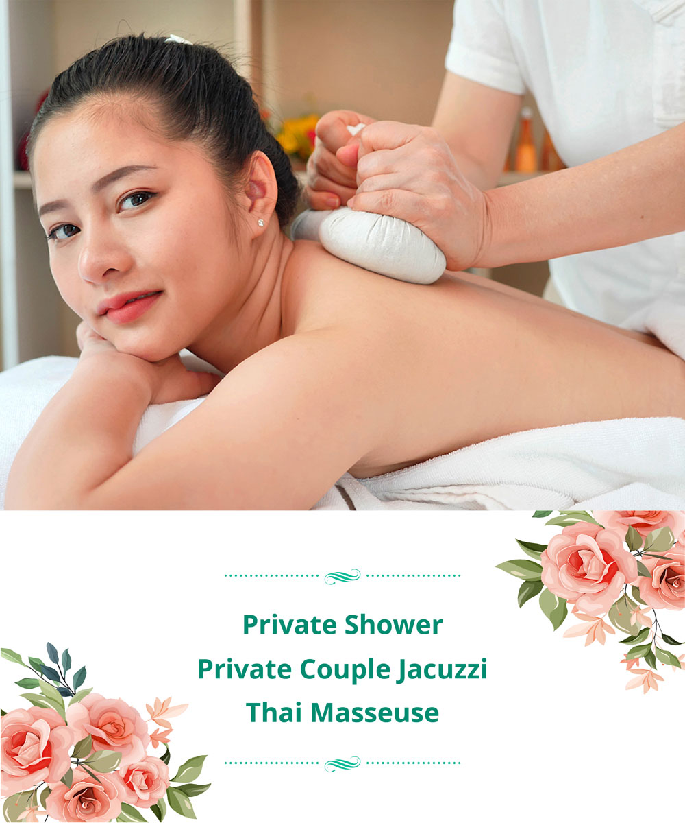 A pretty woman getting a relaxing body massage with Thai herbal ball compress