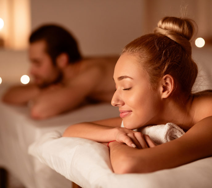 A young couple getting a relaxing Couple Spa in a clean and hygienic spa