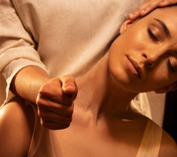 A young lady getting a relaxing neck and shoulder Thai Massage in a spa